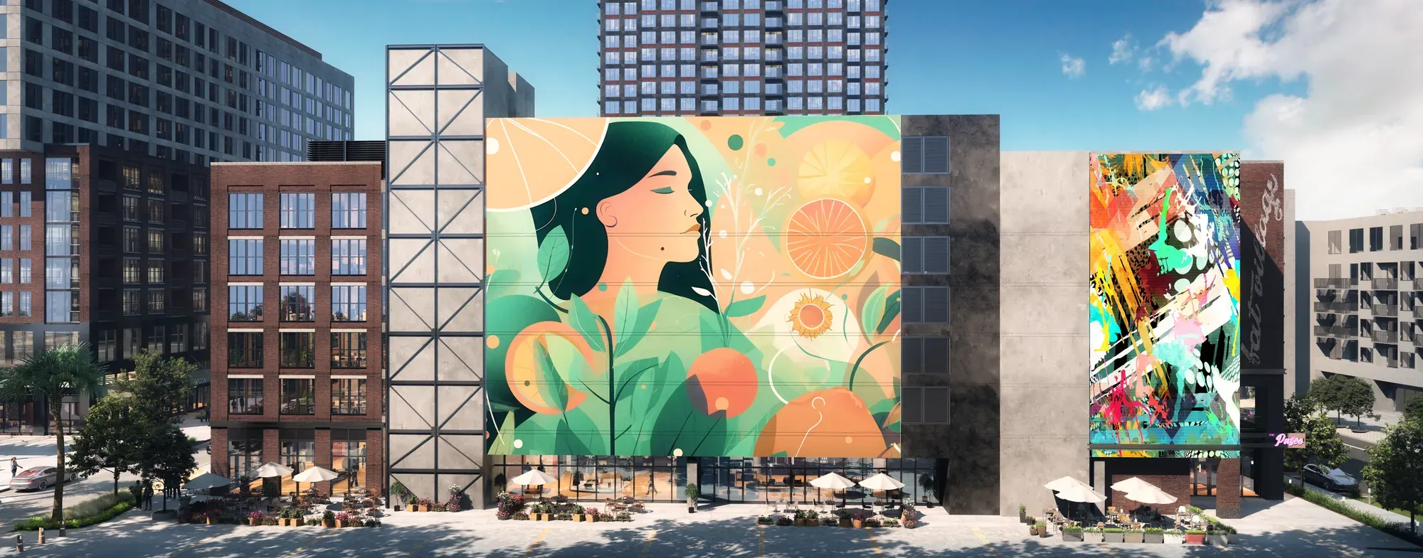 Colorful building murals along a city street with outdoor café seating and blue sky.