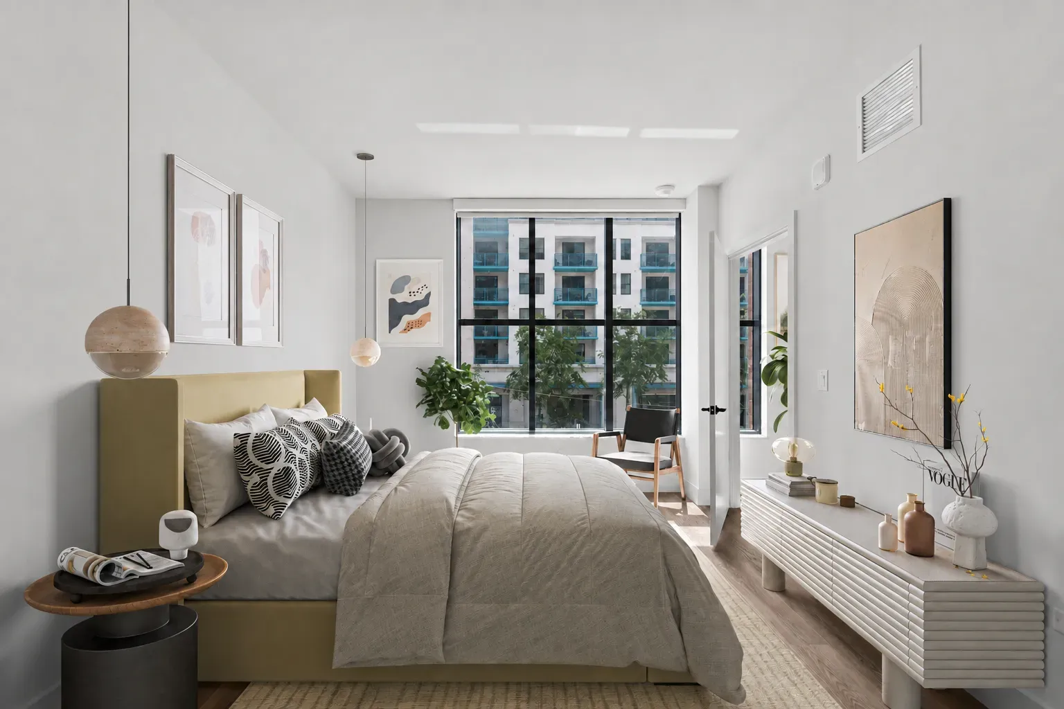 Bright modern bedroom with a large bed and big windows.
